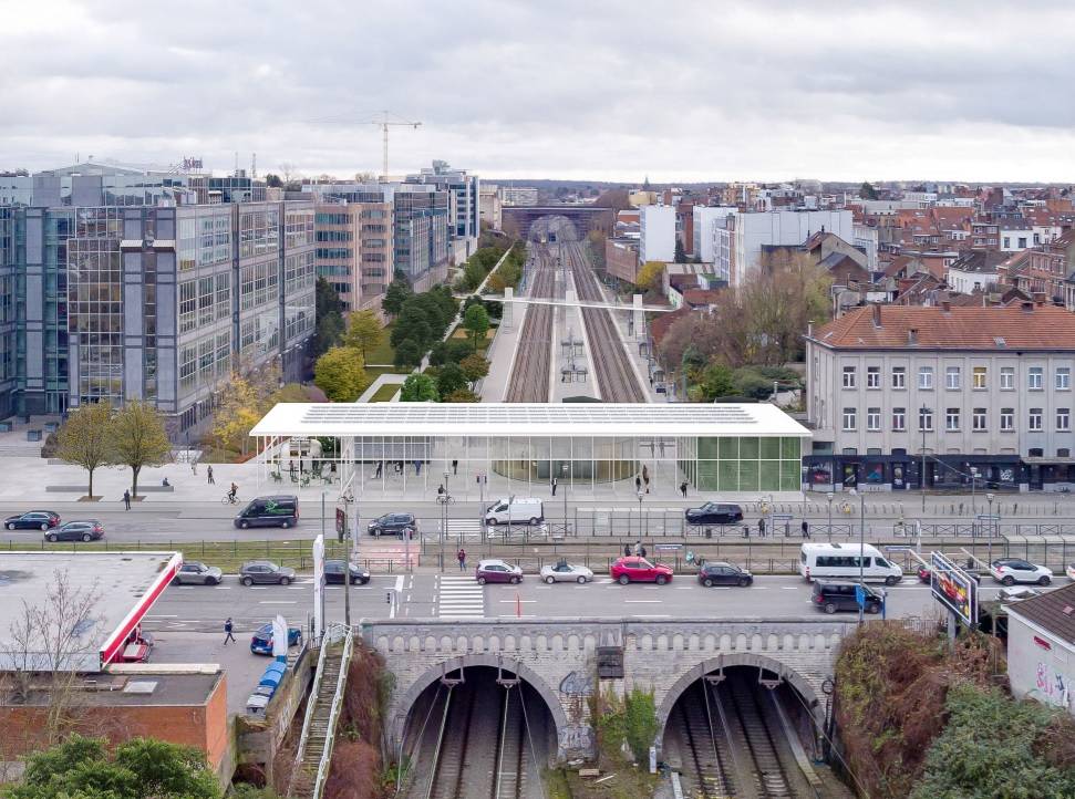 Een simulatiebeeld van het nieuwe treinstation van Etterbeek, met een helder, wit stationsgebouw