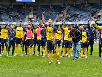 Union's players celebrate after winning a soccer match between KRC Genk and Royale Union Saint-Gilloise, Sunday 21 September 2025 in Genk, a game of day 8 of the 2025-2026 'Jupiler Pro League' first division of the Belgian championship. BELGA PHOTO JILL D
