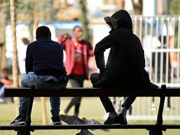 Transmigranten in het Maximiliaanpark