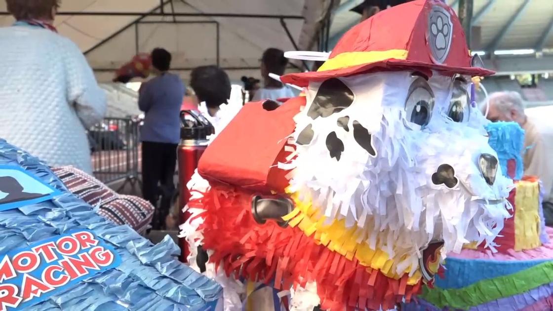 Senior citizens hit piñatas at the Senior Olympics BRUZZ